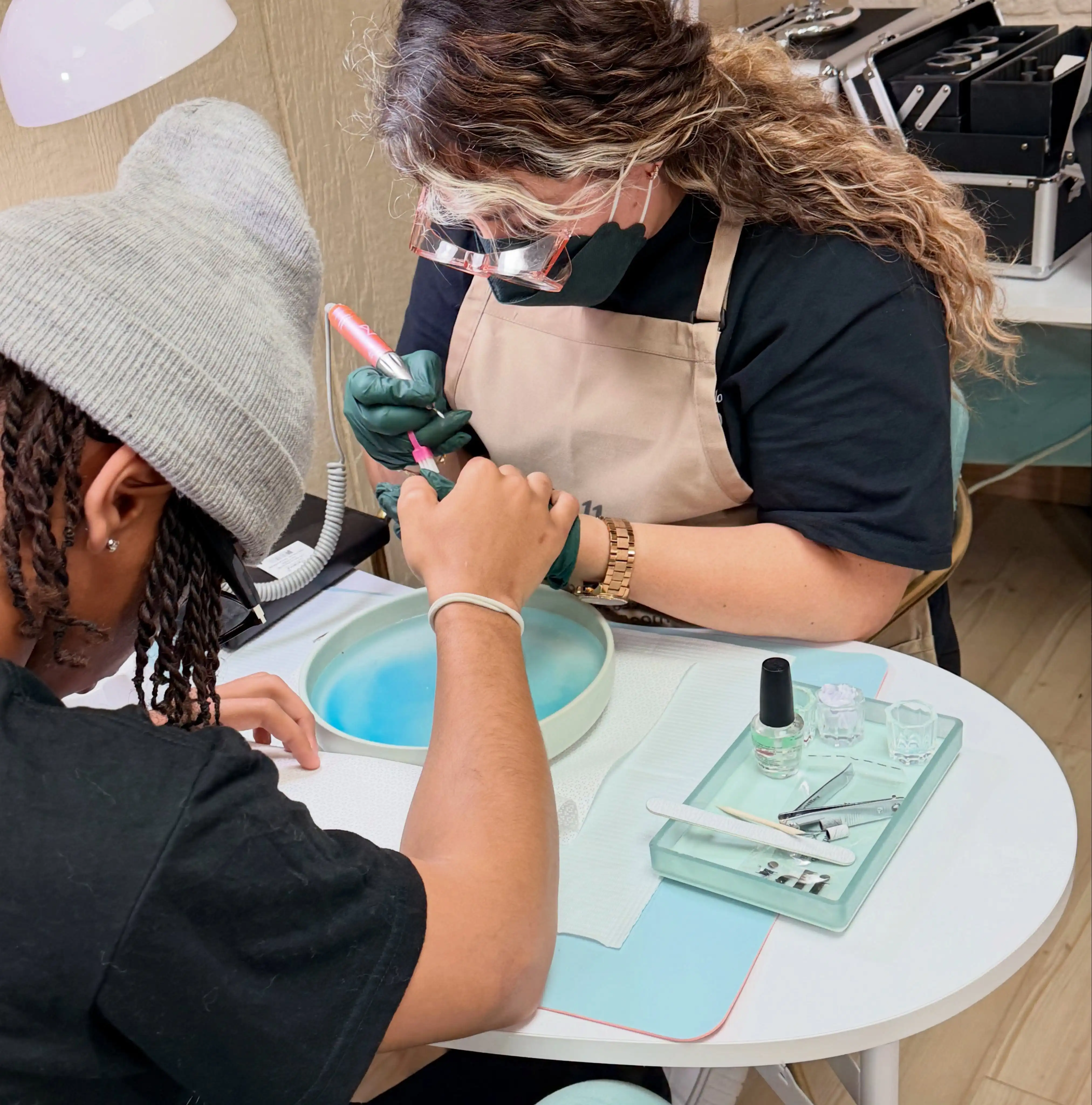 Belle Academy nail technician hands-on manicure training closeup
