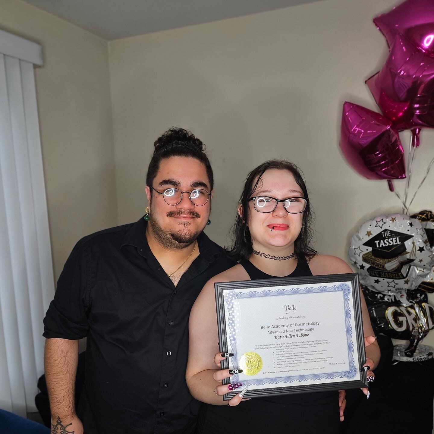 Belle Academy instructor celebrating graduate certificate moment