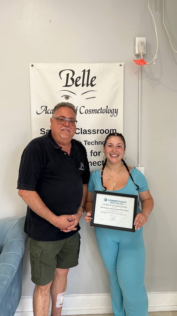 Belle Academy instructor in scrubs with graduate certificate