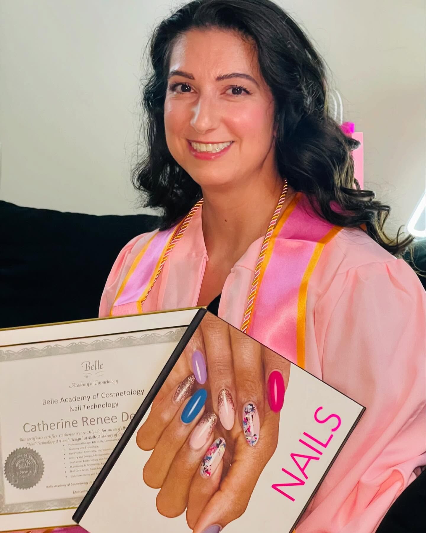 Nail technician graduate displaying manicure work