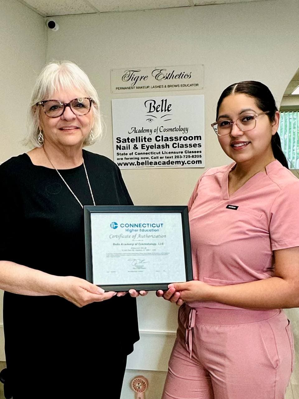 Certificate presentation at Belle Academy training location
